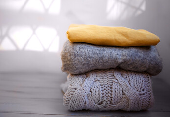 cozy sweaters in ultimate gray and illuminating on a grey background