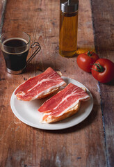 Traditional Spanish appetizer, tomato bread with Spanish ham.
