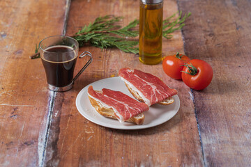 Traditional Spanish appetizer, tomato bread with Spanish ham.