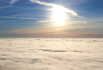 
sunset above the clouds in the mountains