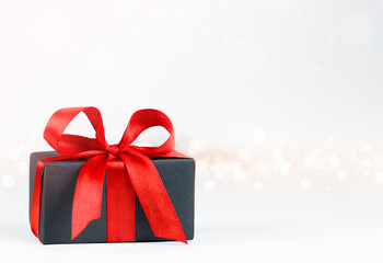 gift box with red bow on defocus lights background