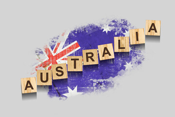 Australia. The inscription on wooden blocks, against the background of the flag of Australia. 3D illustration. Isolated on a gray background.