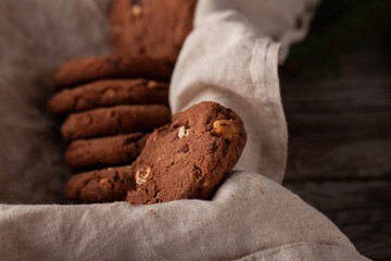 Chocolate cookies on wooden table.