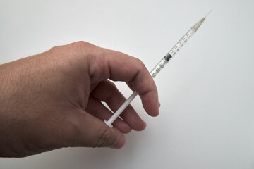 Doctor hand holding syringe to vaccinate with white background and copy space