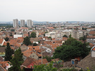 Fototapeta na wymiar Tiled roofs of the Zemun district, the Danube river and the Sava river. Belgrade, Serbia