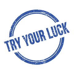 TRY YOUR LUCK text written on blue grungy round stamp.
