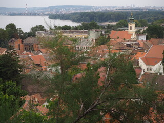 Fototapeta na wymiar Tiled roofs of the Zemun district, the Danube river and the Sava river. Belgrade, Serbia