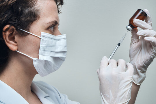 View of a Nurse preparing vaccine dose