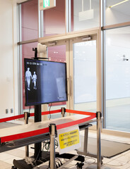 Thermal imaging camera for coronavirus temperature screening  installed at the entrance of a shopping mall
