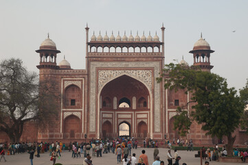 Arched entrance in red sandstone to the Taj Mahal. Agra. Uttar Pradesh. India.