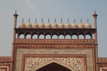 Detail of the arched entrance in red sandstone to the Taj Mahal. Agra. Uttar Pradesh. India.