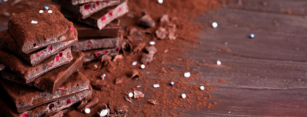 Organic food snack tasty sweet dessert milk dark chocolate bar macro closeup broken slide piece and...