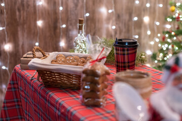 Christmas, New year pastry shop. Gingerbread, marshmallows, cookies, sweets hot chocolate and coffee on the counter in a small cozy cafe. Homemade bakery