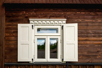 Window with traditional ornaments in ethnographic village Stripeikiai, Lithuania