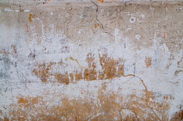 Biege concrete background with cracks and scratches
