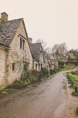 Fototapeta na wymiar Row of Historic Quintessential Cotswold Cottages In Bibury