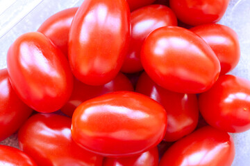 Fresh cherry tomatoes background texture. Photo of cherry tomatoes. Close up