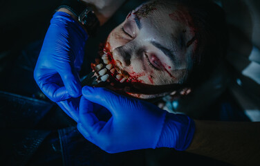 Woman in image of ugly mutant treats her teeth in dental clinic.