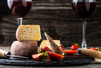 cheese and wine on old wooden table. catering, banner, menu, recipe, place for text