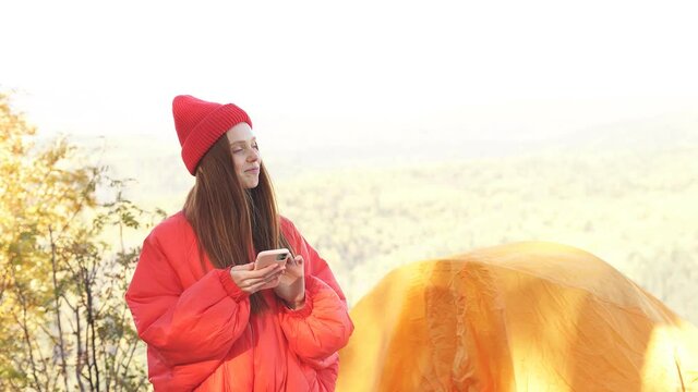 Portrait of good-looking fit redhead woman is travelling on mountains.