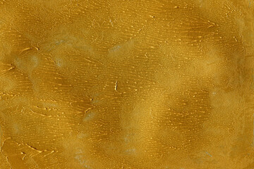 Modern contemporary acrylic background. Gold paint texture made with a brush. Luxury abstract painting on paper. Mess on the canvas.