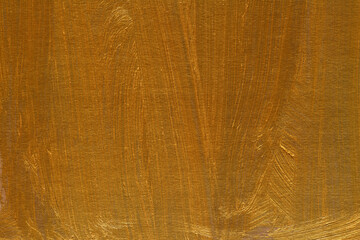 Modern contemporary acrylic background. Gold paint texture made with a brush. Luxury abstract...