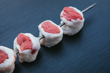 Skewers of fresh and raw shish kebab or barbecued shashlik meat. 