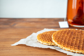Traditional local signature authentic Dutch Netherlands sweet fresh homemade of delicious tasty stack brown golden waffle caramel honey sugar syrup for dessert in cafe with coffee tea call Stroopwafel