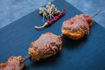 Skewers of grilled shish kebab or barbecued shashlik meat. 