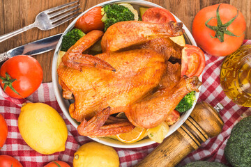 roasted chicken and vegetables on wooden table