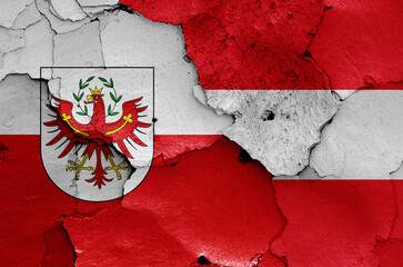 flags of Tyrol state and Austria painted on cracked wall