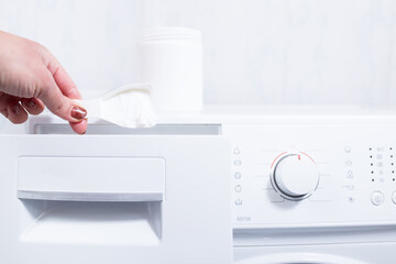 Start washing. Load a washing powder.