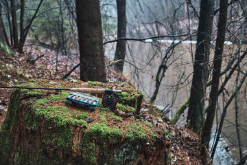 Box with flies on the background of the river. Fly fishing.