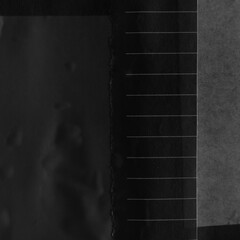 Black torn paper collage close-up. Texture made from various paper and cardboard parts. Damaged old paper background. Vintage blank wallpaper. Material design backdrop.