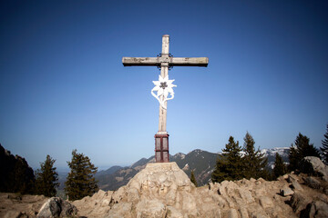 Summit cross of mountain Heuberg, Bavaria in springtime