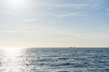Obraz premium 2 fishing boats on the north sea during sunset in front of the Dutch coast near the island of Texel. 
