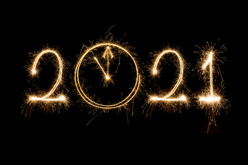 Obraz na płótnie Canvas Happy New Year 2021. Sparkling burning text Happy New Year 2021 isolated on black background.New year countdown