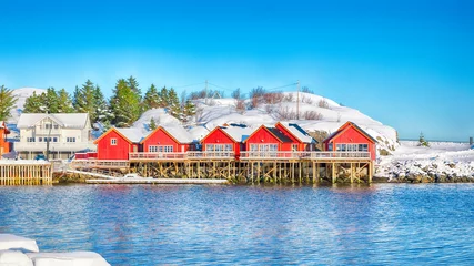 Fototapete Reinefjorden Traditional Norwegian red wooden houses on the shore of  Reinefjorden near Hamnoy village