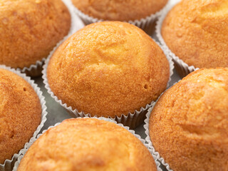 Pattern from baked muffins in close-up. Fresh pastries. 