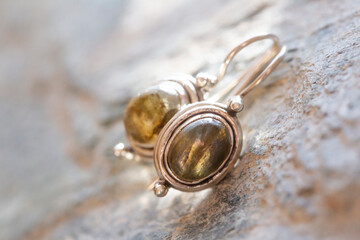 pair of sterling silver mineral earrings on natural background