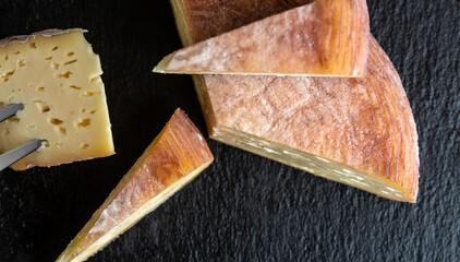 Group of Natural mountain cheeses made in the traditional Craft cheese from cows and goats milk