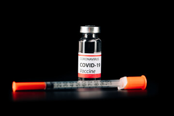 COVID-19 vaccine isolated on black background. Healthcare And Medical concept.