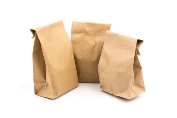 paper disposable bag of brown kraft paper on white background, concept of rejection of plastic...