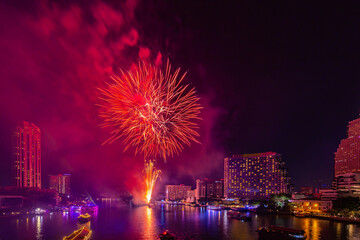 Fireworks to celebrate New Year on the Chao Phraya River in Bangkok, Thailand.
