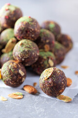 Healthy homemade paleo, hight protein chocolate energy balls with rolled oats, nuts, dates and almond flakes, dried raspberries. Raw vegetarian sweets. Sugar free, gluten free, lactose free