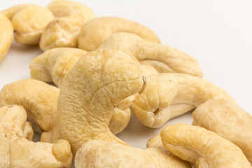 Raw cashew nuts isolated on white background.