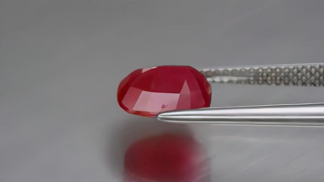 natural red ruby on the grey background