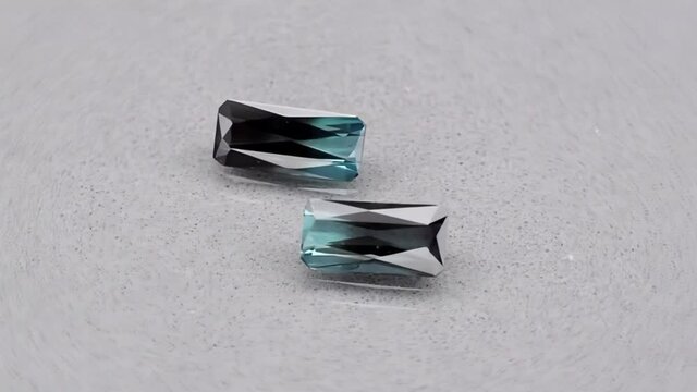 natural green indicolite tourmaline on the grey background
