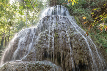 Beautiful shot of the waterfalls in the historical garden park of the Stone Monastery in Nuevalos