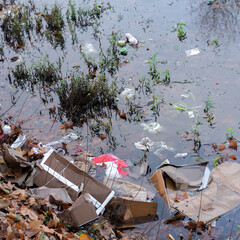 Trash thrown away in water, environmental problems. Nature disaster concept
